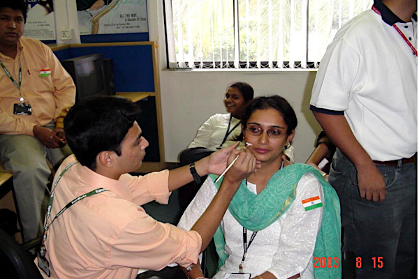 Face painting the tricolor on independence day.