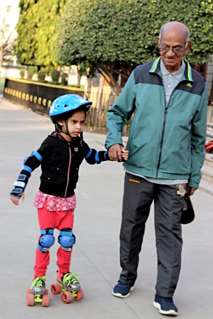 Father Mani with a young skater.