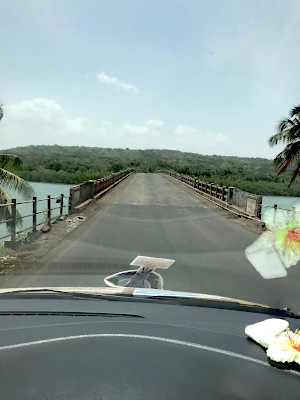 Crossing a bridge over a stream in the Western Ghats.