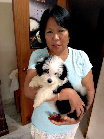 Shanti with her pet dog, Lulu - mixed breed of Apso.