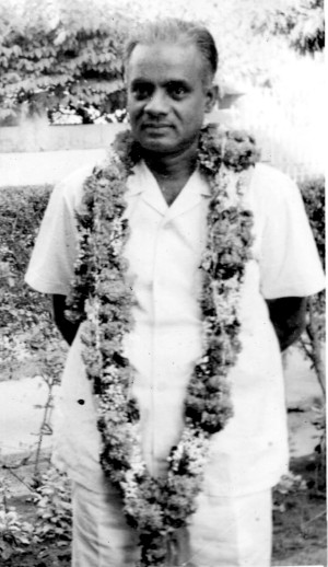 M. Ramachandran, being welcomed with a garland.