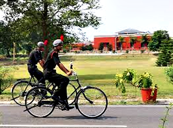 Gentlemen Cadets using bicycles to get around on the campus at the Indian Military Academy (IMA), Dehradun.