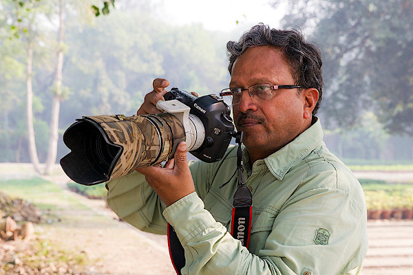Vinod Goel with a camera by Canon